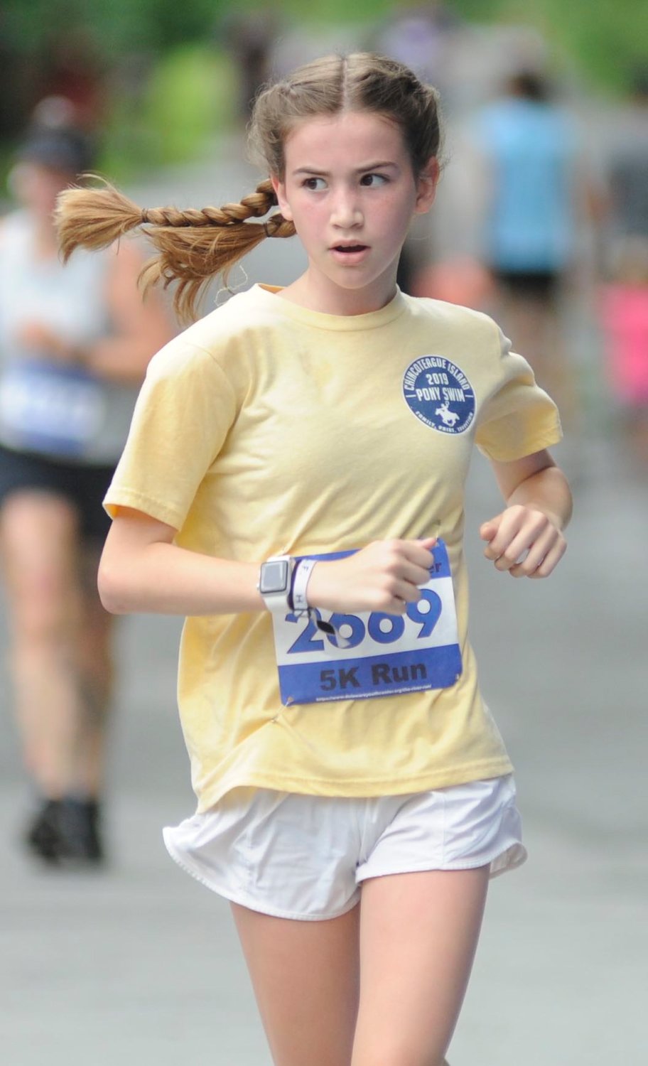 Ponytails. Megan Dowling, a 13-year-old runner, placed 33rd in the female 5K run...